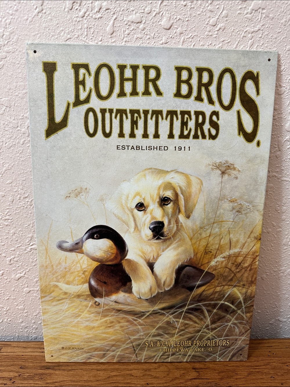 Labrador puppy and Duck Metal Sign artwork by L.R. KAATZ Leohr Bros. Outfitters